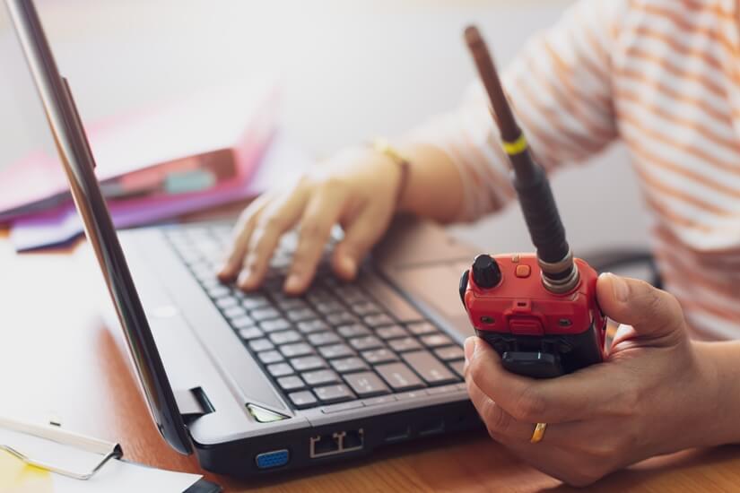 person researching walkie talkies problems online