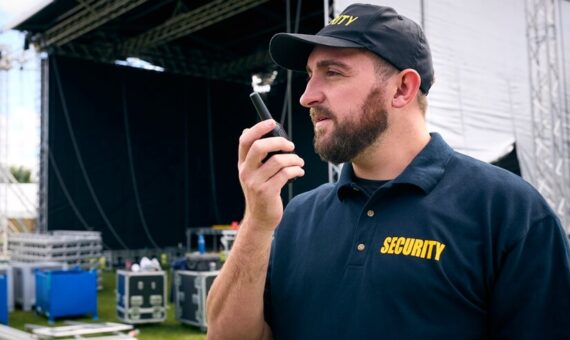 Concert Security staff using a walkie talkie