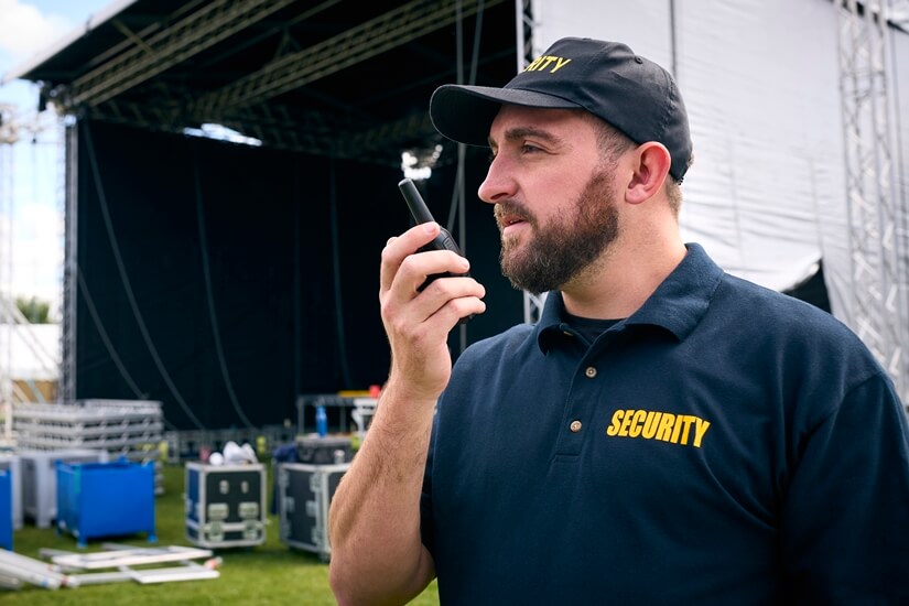 Concert Security staff using a walkie talkie